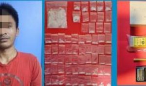 Pelaku yang diamankan oleh polisi.
