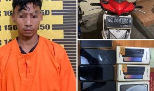 Pelaku yang diamankan oleh polisi.